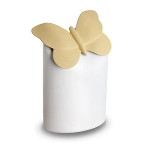 Yellow butterfly atop a white cremation urn vessel